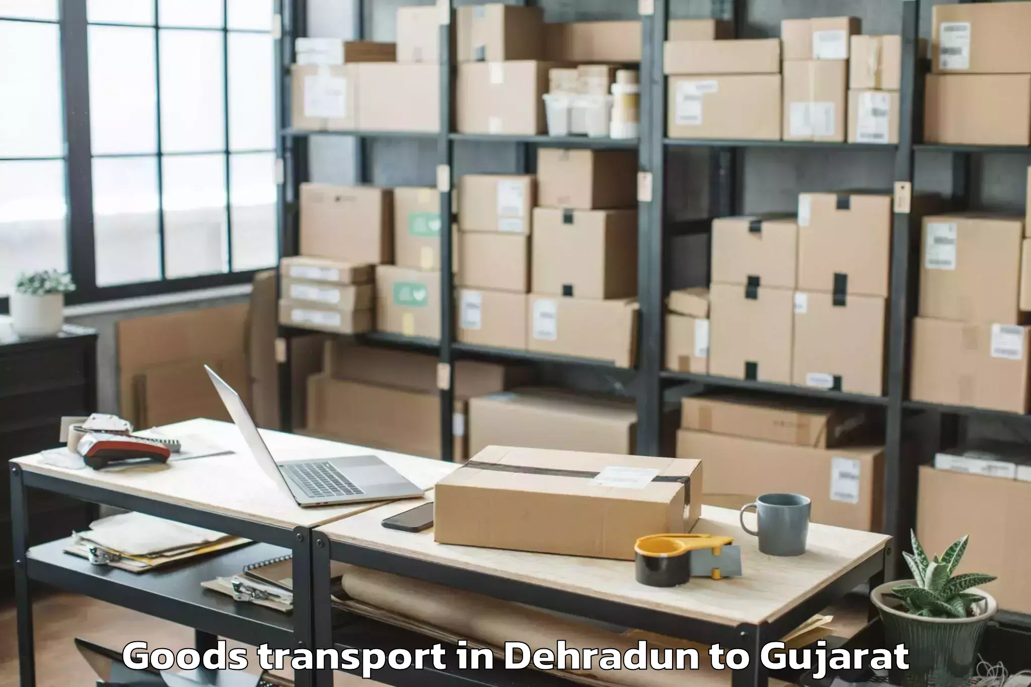 Professional Dehradun to Jamjodhpur Goods Transport